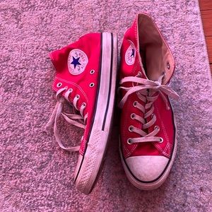 Red high top Chuck Taylors